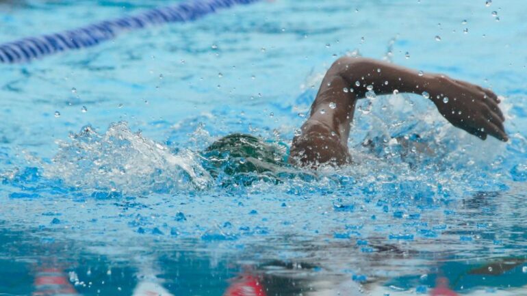 A swimmer swimming laps in a pool.