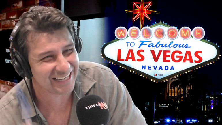Andrew Embley in front of the Welcome to Las Vegas sign