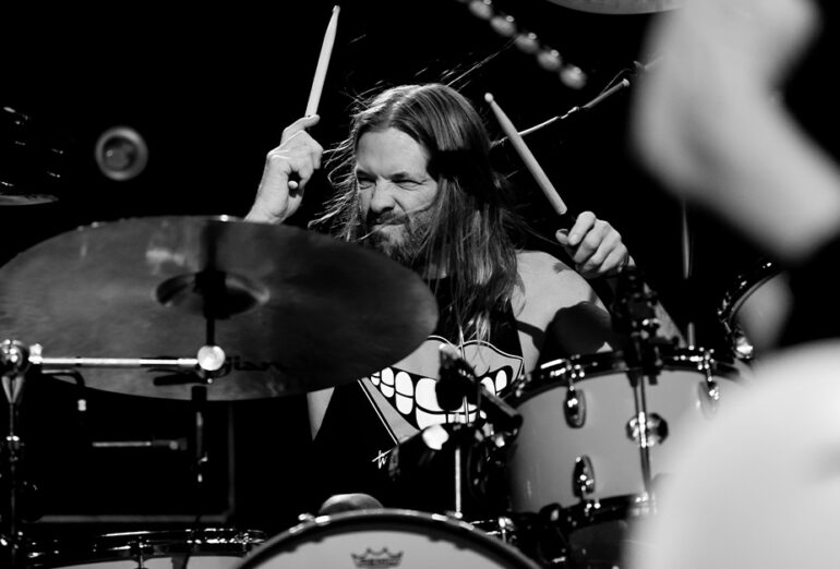 Taylor Hawkins playing the drums.