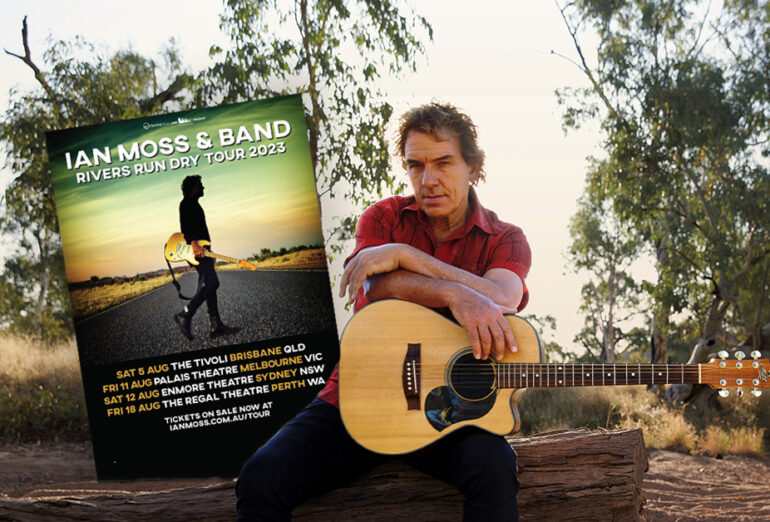 Ian Moss pictured sitting on a log in the forest with his guitar. Superimposed is the 'Rivers Run Dry' tour art.