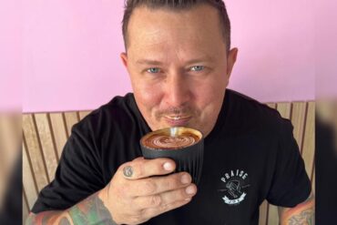 Phil sipping a cup of coffee.