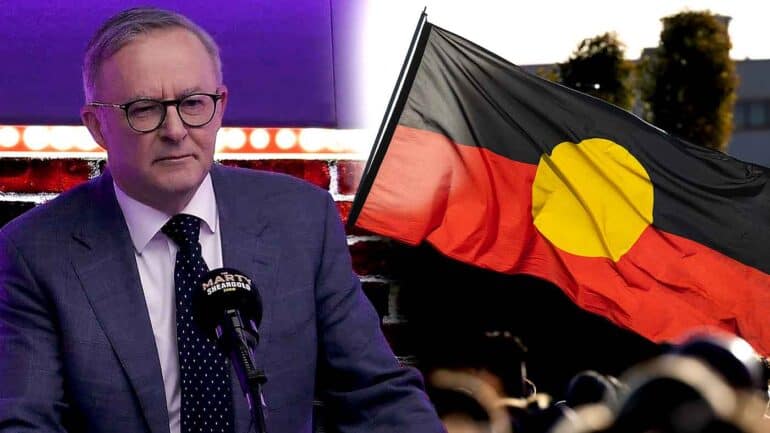 Anthony Albanese in the Marty Sheargold Show studio and the Aboriginal flag. This image has been digitally altered