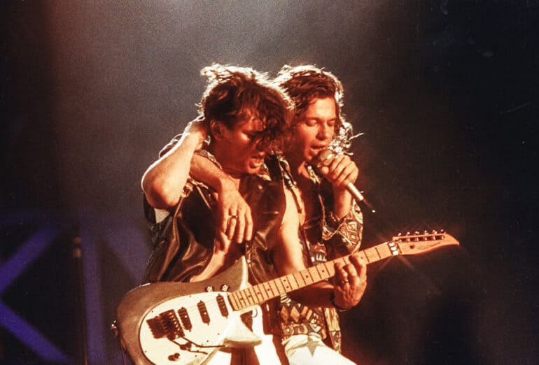 Tim Farriss and Michael Hutchence of INXS performs on stage at Wembley Stadium on July 13th, 1991 (Photo by Pete Still/Redferns)