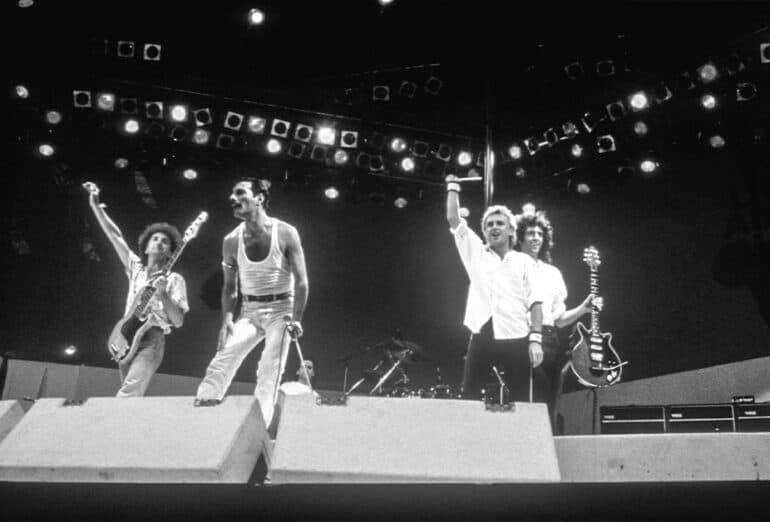 Queen at Live Aid on July 13, 1985 in London, United Kingdom. (Photo by FG/Bauer-Griffin/Getty Images) (Monochrome Edit by Kalun Townsend/LiSTNR)