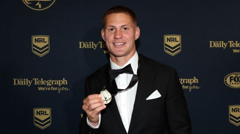 Kalyn Ponga holding up his Dally M Medal.
