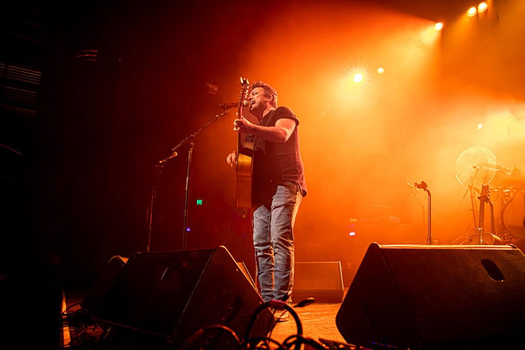 Travis Collins pictured on stage performing at The Enmore Theatre in Sydney on Sep 03, 2023 (Image: Chris Neave)