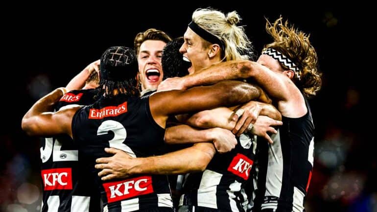 Collingwood players celebrating their win over Melbourne in the qualifying final