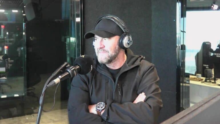 Steve in studio with arms folded.