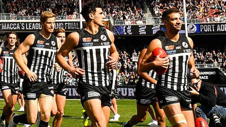 Port Adelaide Magpies running out for a SANFL grand final. Bernie Vince says they should split from the Power
