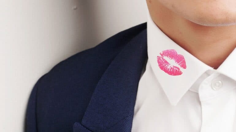 man with lipstick on collar
