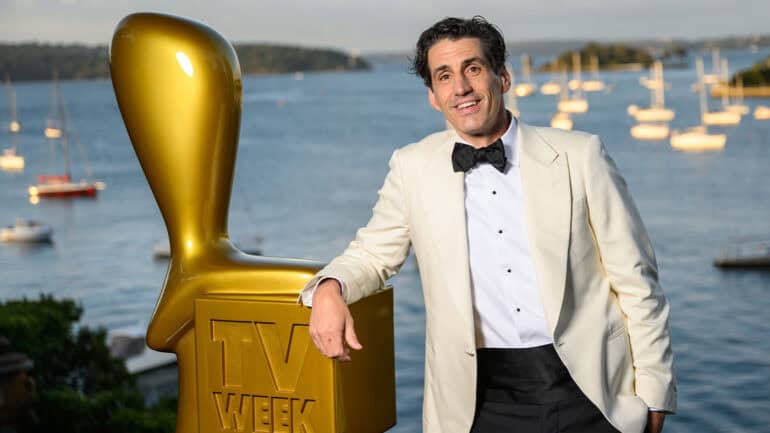 host Andy Lee with the large logie award