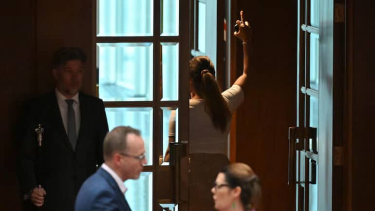 Senator Lidia Thorpe leaving senate after her suspension.