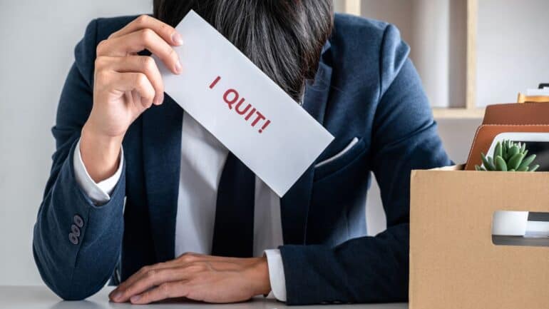 A man in the office thinking about revenge quitting