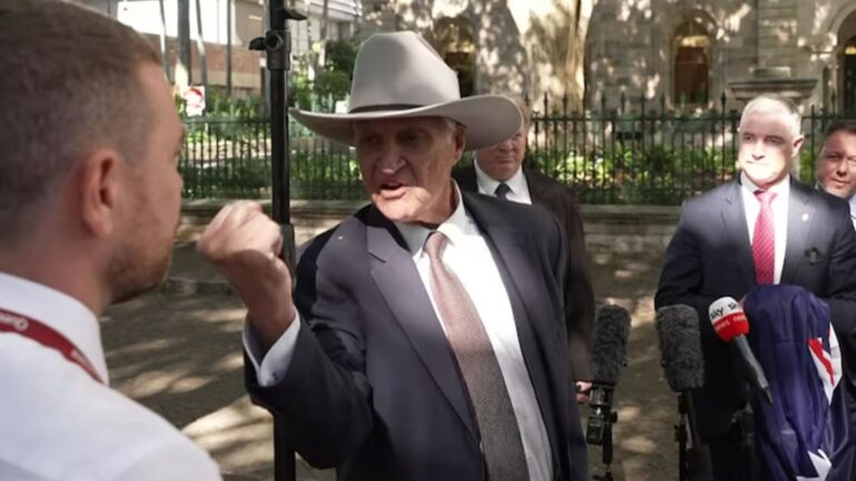 Queensland MP Robbie Katter has stood by his father, federal independent MP Bob Katter, after a fiery confrontation with a journalist over the family’s Lebanese heritage.